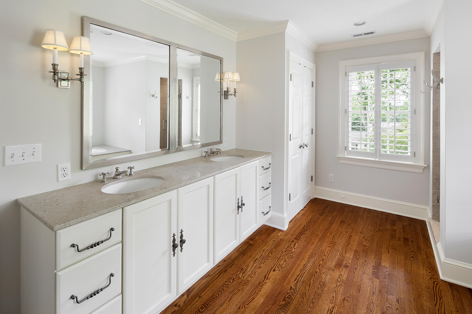 21 Briar Brae Road Darien, CT 06820 - Photo 19 of 35 a spacious bathroom with a granite countertop sink and a mirror