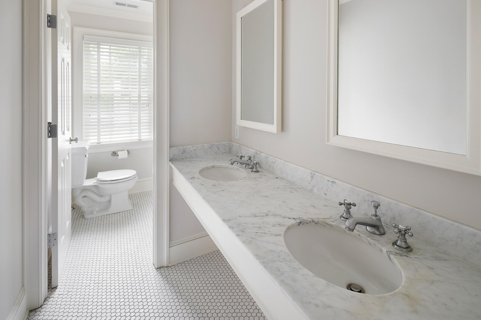 21 Briar Brae Road Darien, CT 06820 - Photo 26 of 35 a bathroom with a granite countertop sink a toilet and a window