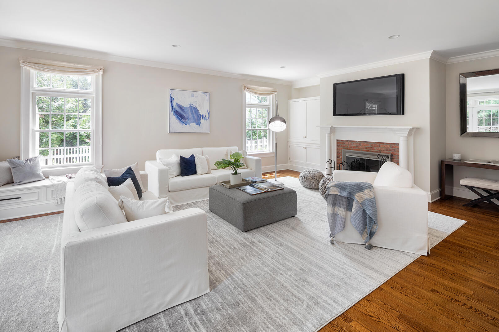 21 Briar Brae Road Darien, CT 06820 - Photo 9 of 35 a living room with furniture fireplace and a flat screen tv