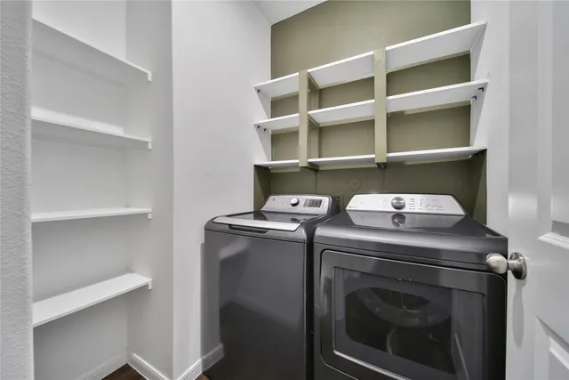a utility room with dryer and washer