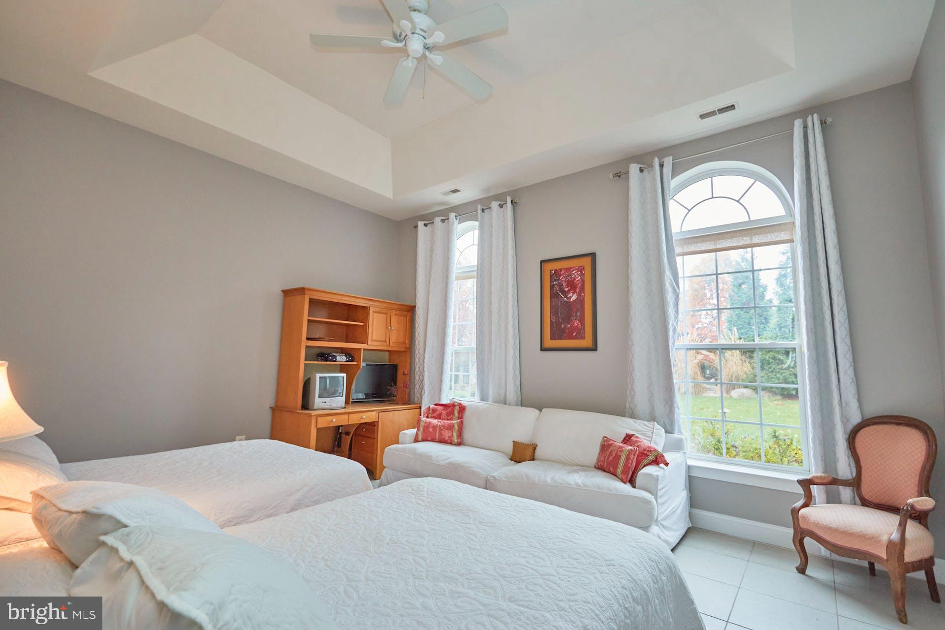 12815 Braddock Road Clifton, VA 20124 - Photo 14 of 21 a bedroom with two beds and a large window