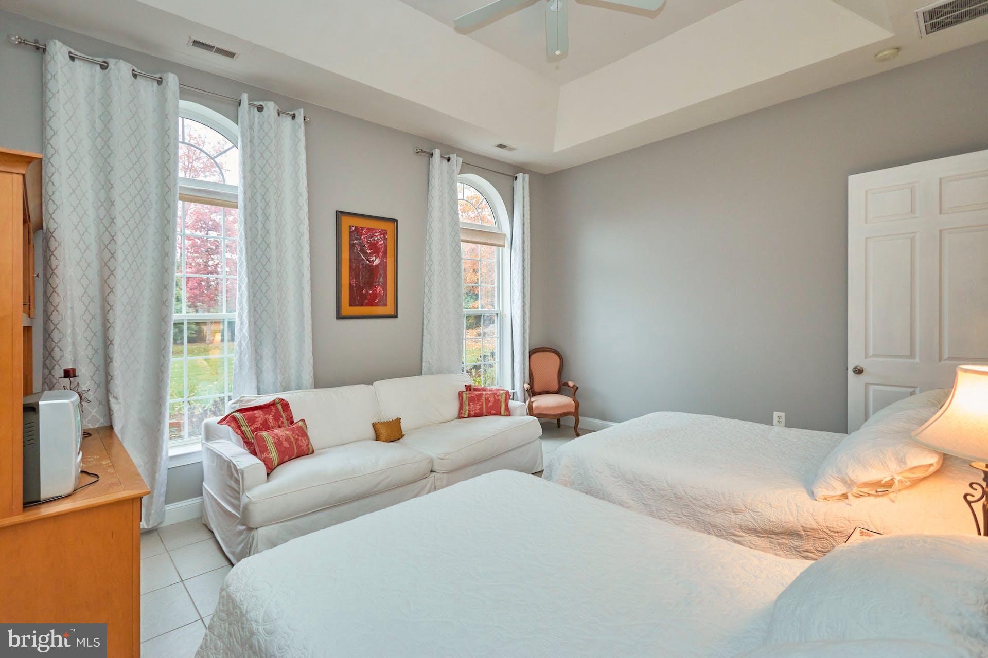 12815 Braddock Road Clifton, VA 20124 - Photo 15 of 21 a bedroom with two beds and a couch