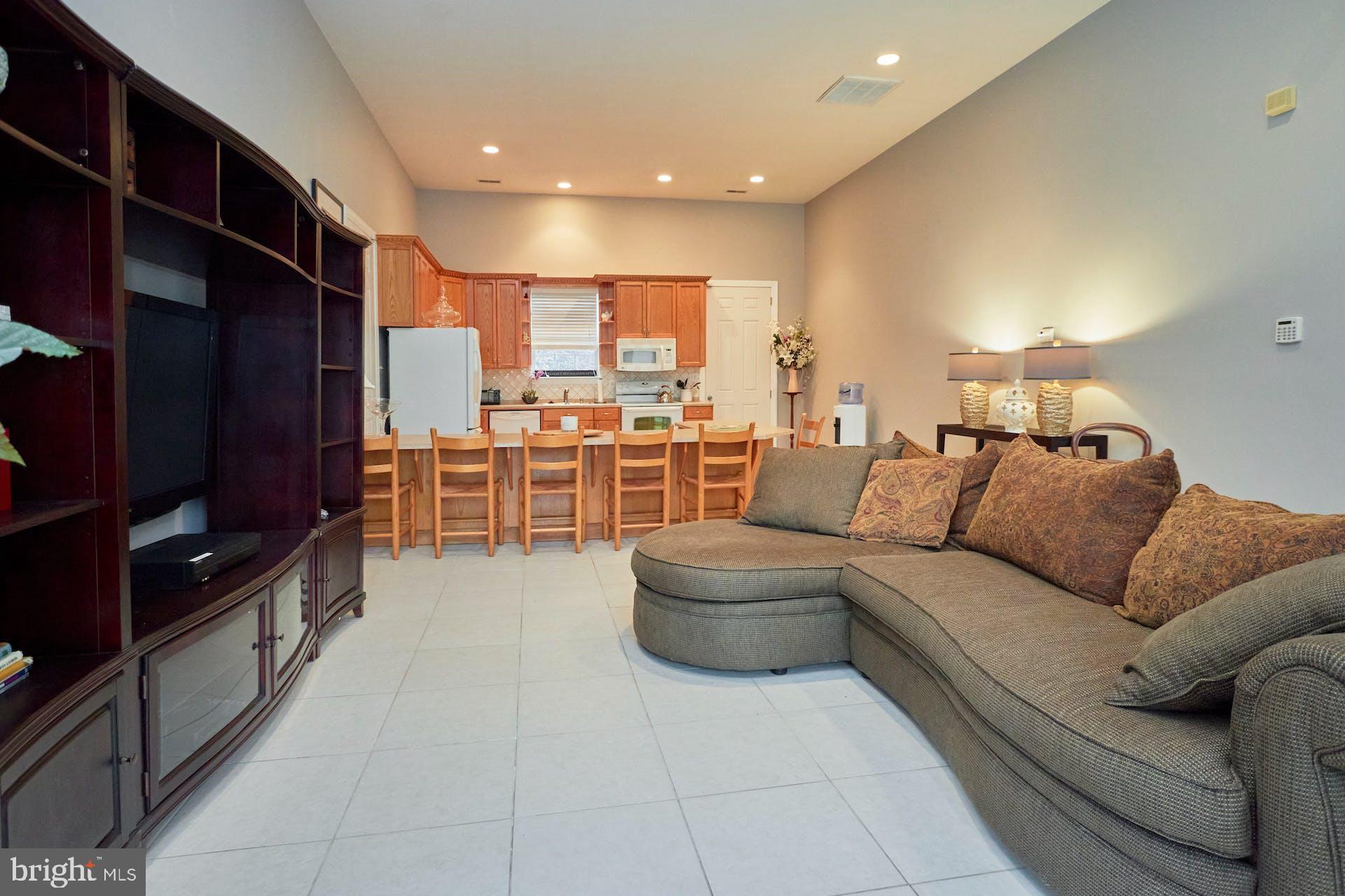 12815 Braddock Road Clifton, VA 20124 - Photo 3 of 21 a living room with furniture and a flat screen tv