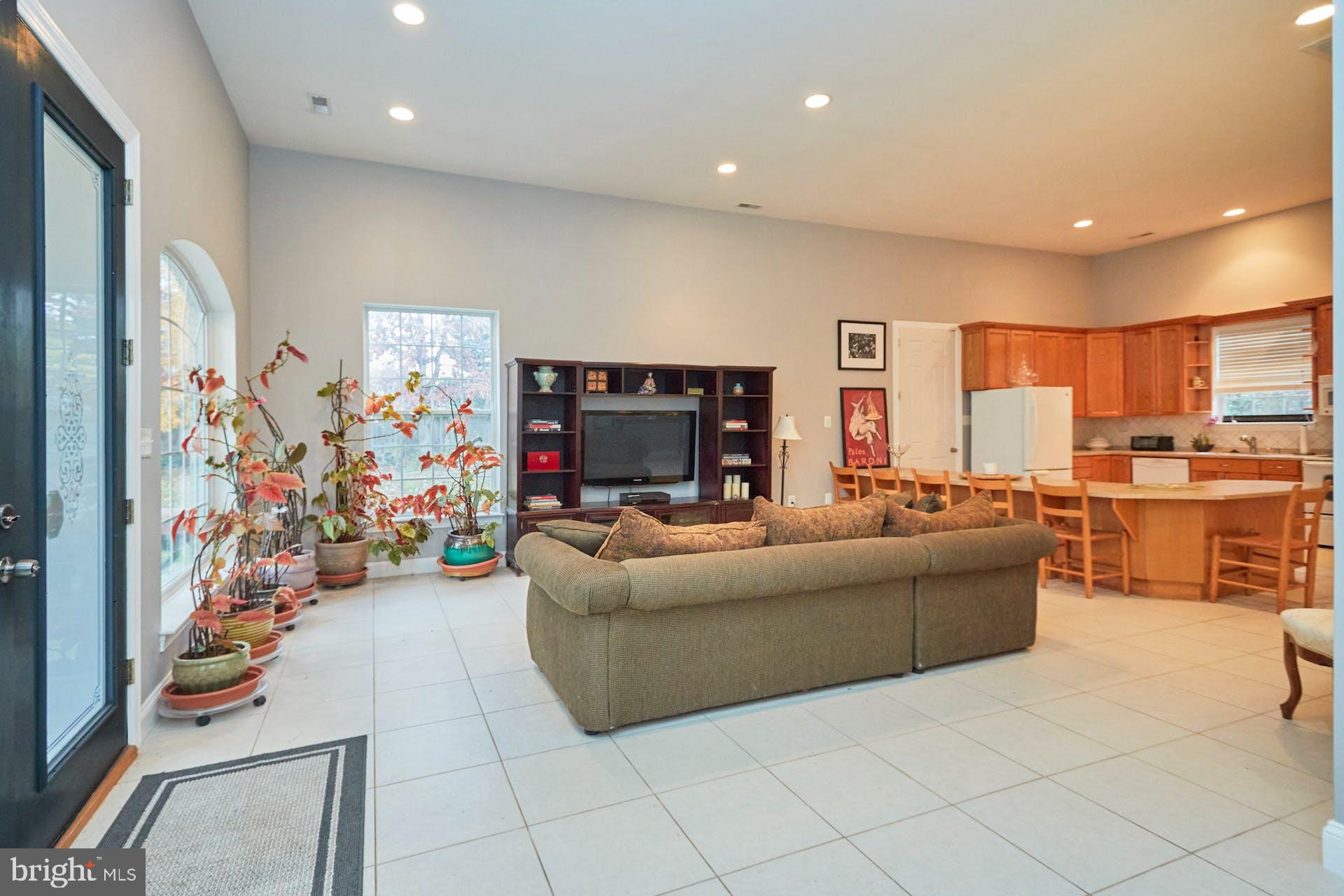 12815 Braddock Road Clifton, VA 20124 - Photo 4 of 21 a living room with furniture and a flat screen tv