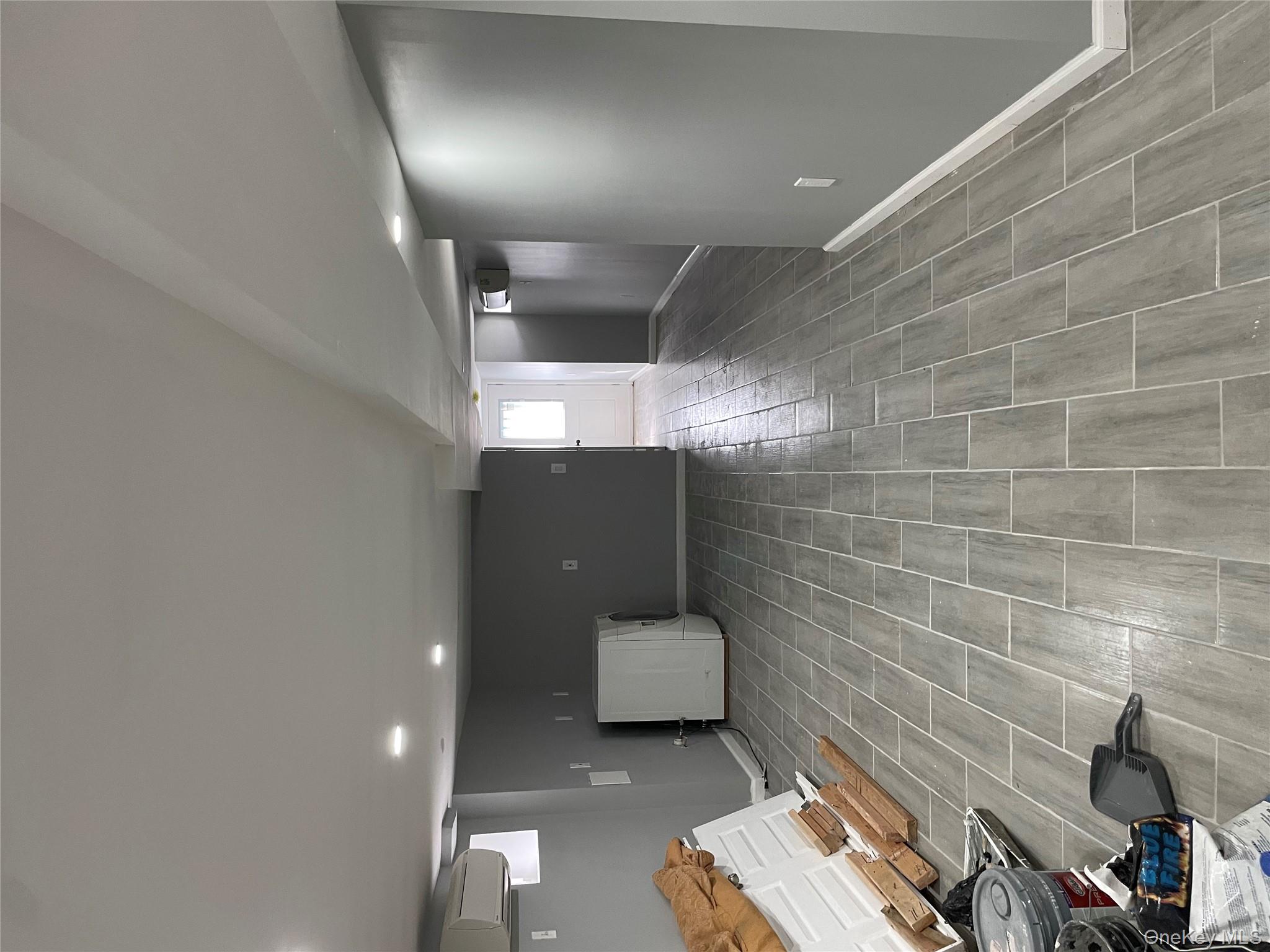 131-08 Sutter Avenue Queens, NY 11420 - Photo 12 of 21 a view of a big room with wooden floor