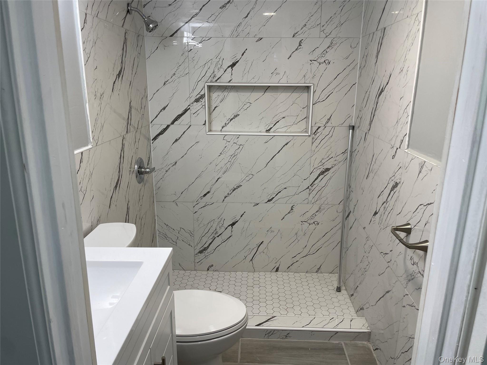 131-08 Sutter Avenue Queens, NY 11420 - Photo 14 of 21 a bathroom with a toilet and a shower