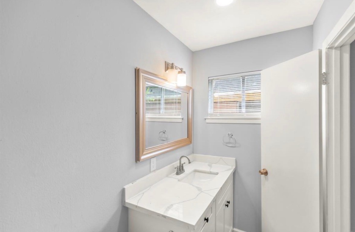 7515 Jason Street Houston, TX 77074 - Photo 12 of 24 a bathroom with a sink toilet and shower