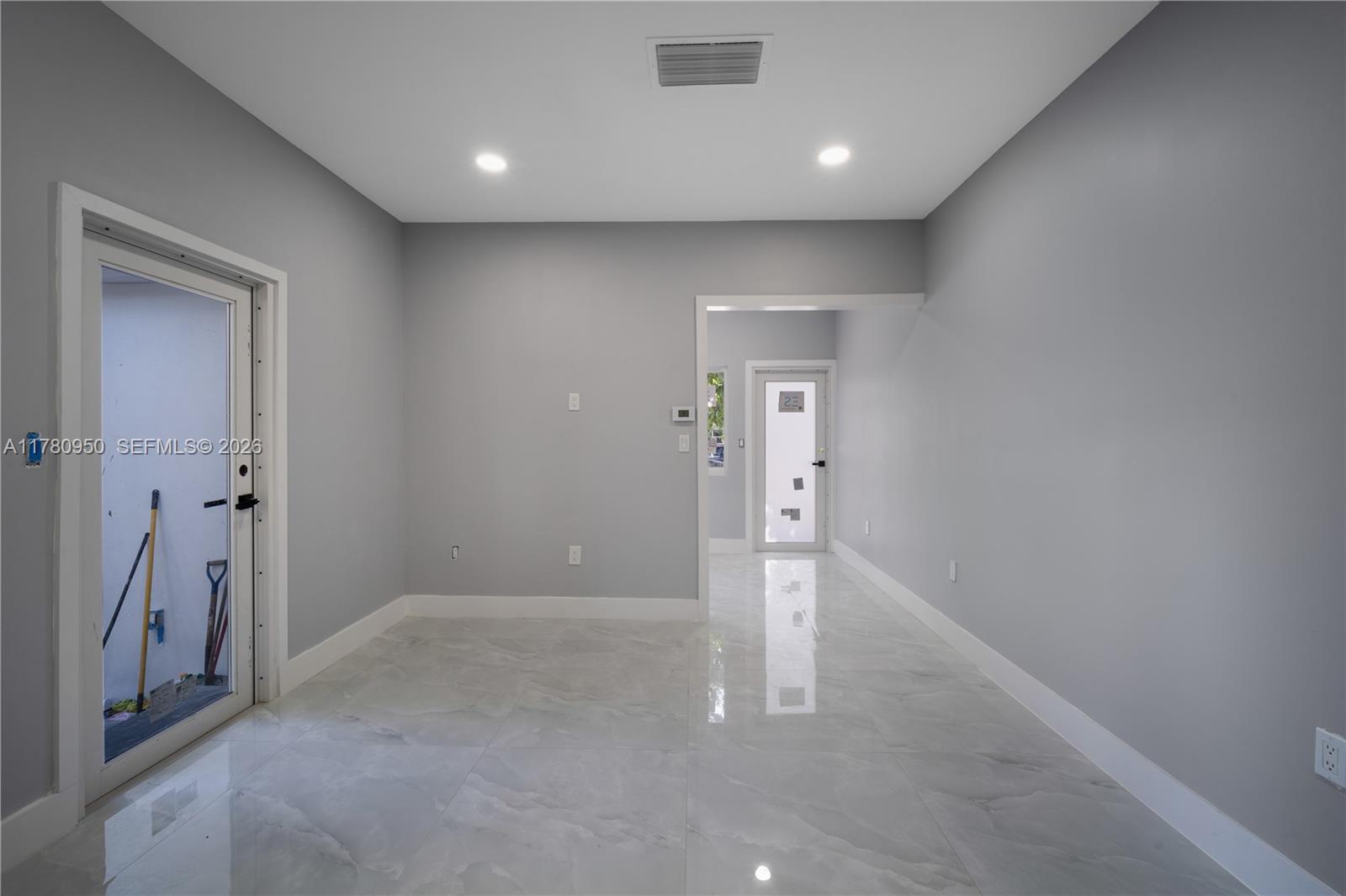 1114 Southwest 13th Court Miami, FL 33135 - Photo 12 of 43 a view of an empty room