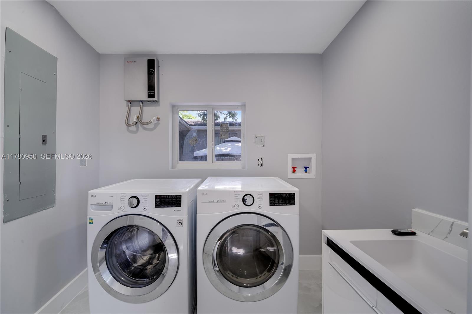 1114 Southwest 13th Court Miami, FL 33135 - Photo 15 of 43 a utility room with dryer and washer