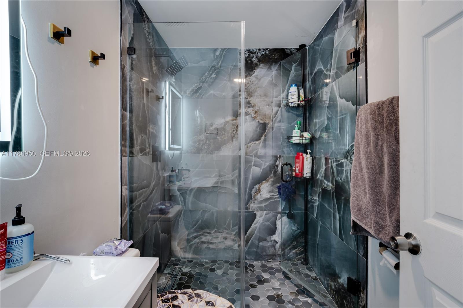 1114 Southwest 13th Court Miami, FL 33135 - Photo 16 of 43 a bathroom with a shower and a toilet