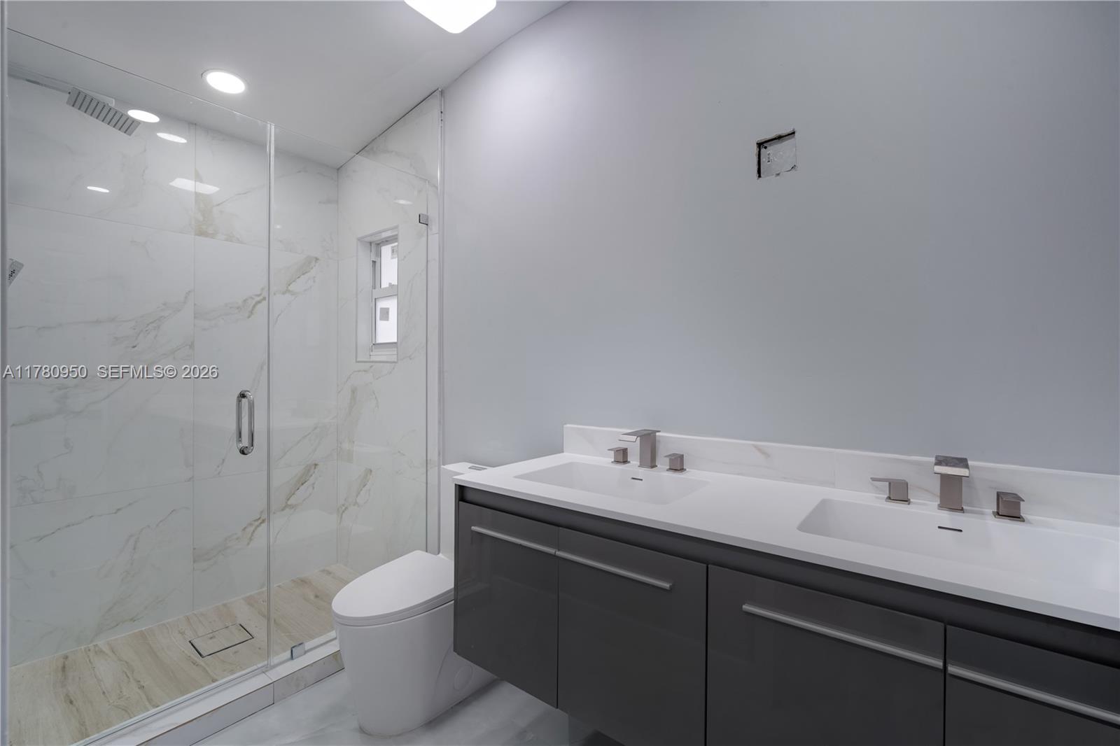 1114 Southwest 13th Court Miami, FL 33135 - Photo 20 of 43 a bathroom with a sink toilet and shower
