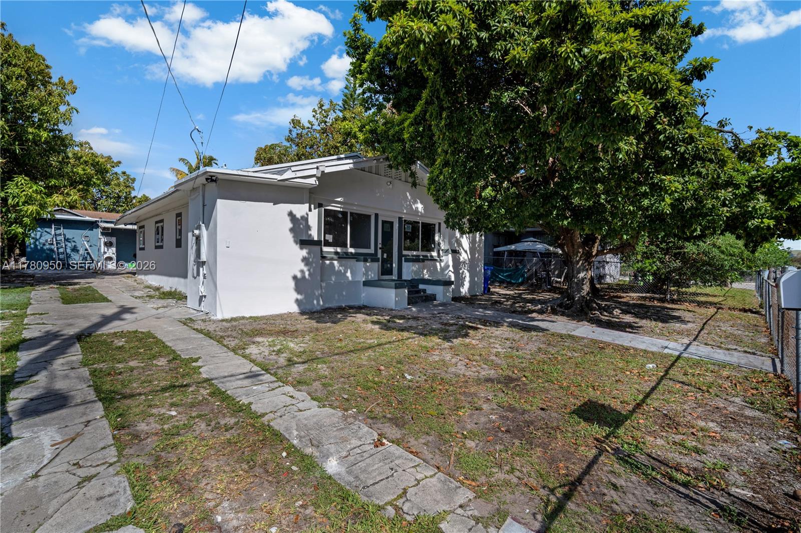 1114 Southwest 13th Court Miami, FL 33135 - Photo 2 of 43 a view of a house with backyard and sitting area