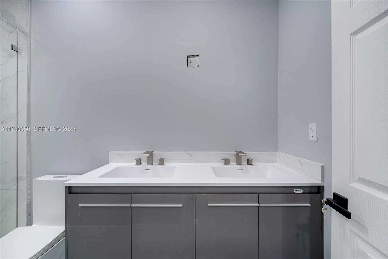1114 Southwest 13th Court Miami, FL 33135 - Photo 21 of 43 a bathroom with a sink and a toilet