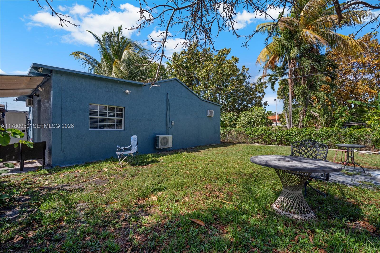 1114 Southwest 13th Court Miami, FL 33135 - Photo 31 of 43 a view of a backyard with plants and a barbeque