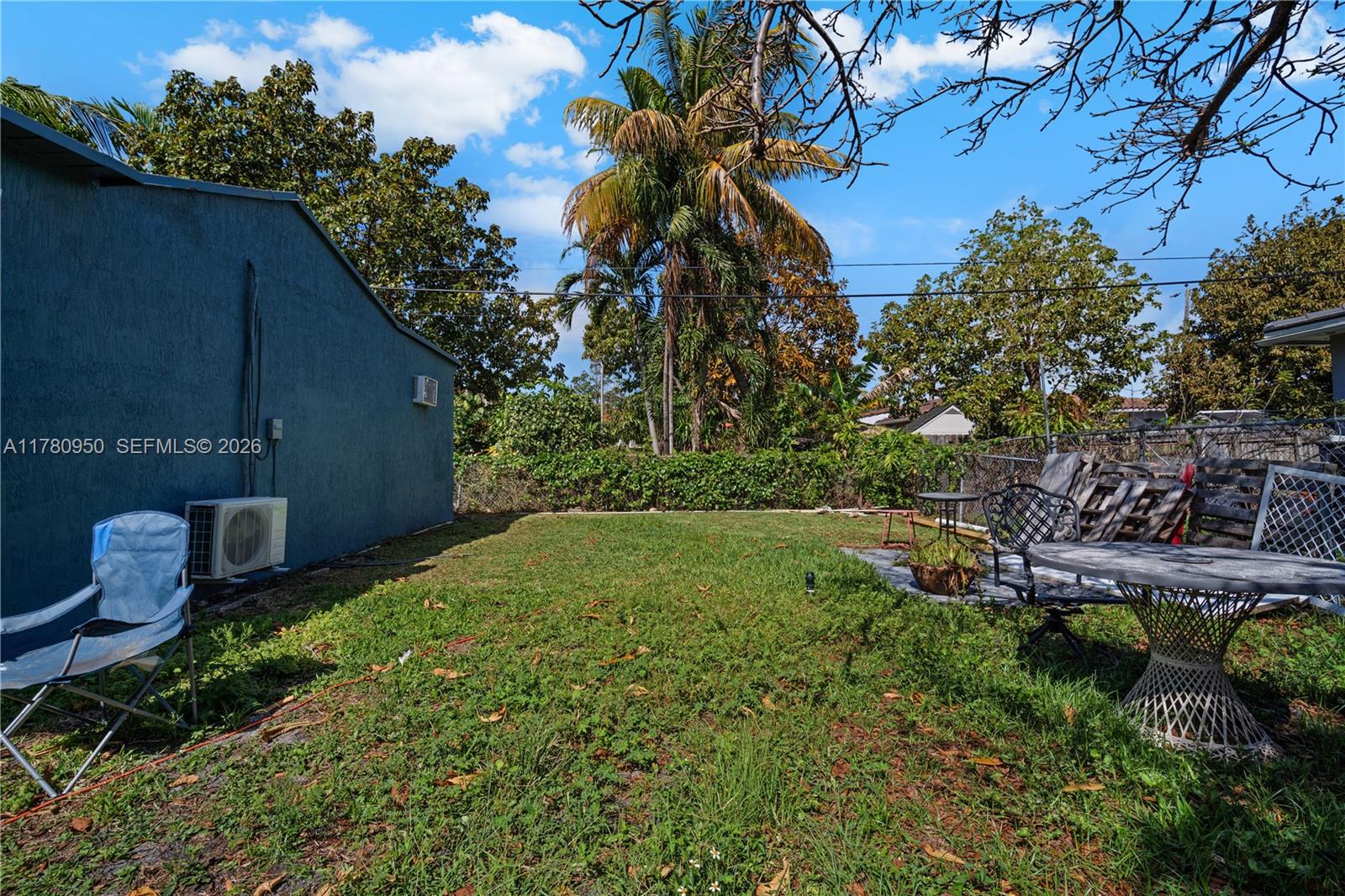 1114 Southwest 13th Court Miami, FL 33135 - Photo 32 of 43 a backyard of a house with lots of green space