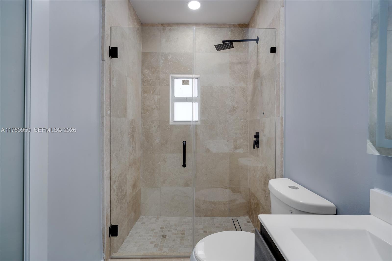 1114 Southwest 13th Court Miami, FL 33135 - Photo 39 of 43 a bathroom with a toilet and shower
