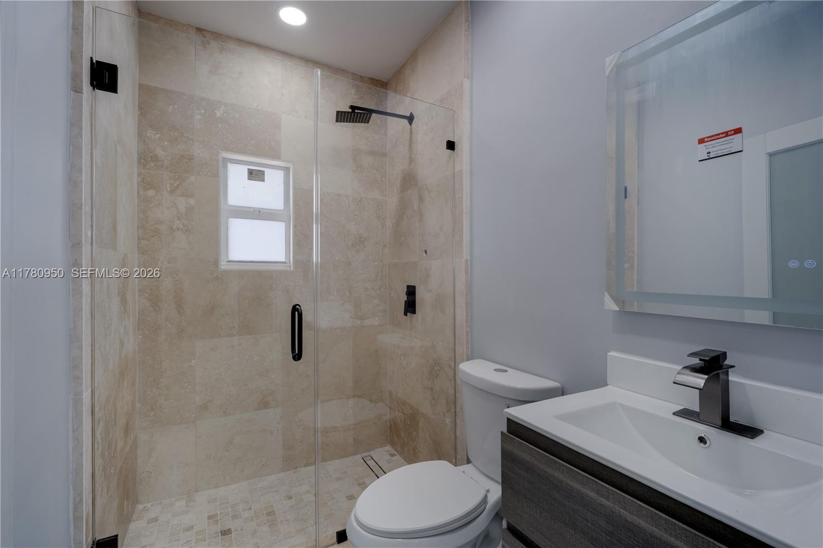 1114 Southwest 13th Court Miami, FL 33135 - Photo 40 of 43 a bathroom with a sink toilet and shower