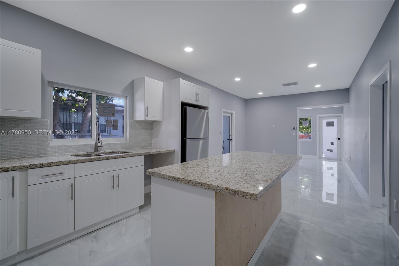1114 Southwest 13th Court Miami, FL 33135 - Photo 9 of 43 a kitchen with sink and refrigerator