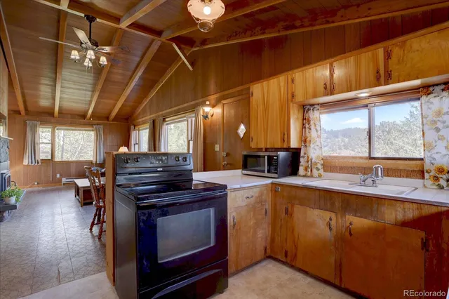 a kitchen with a stove and a sink