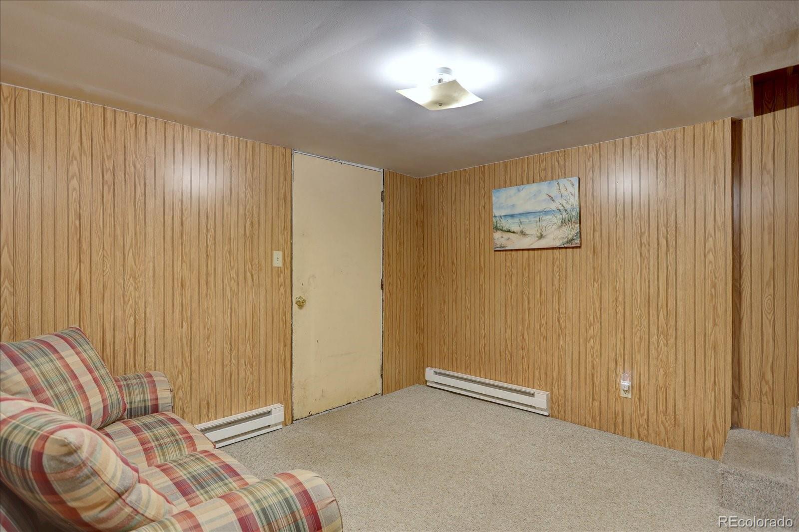 255 Saddlestring Road Bailey, CO 80421 - Photo 22 of 49 a living room with a couch