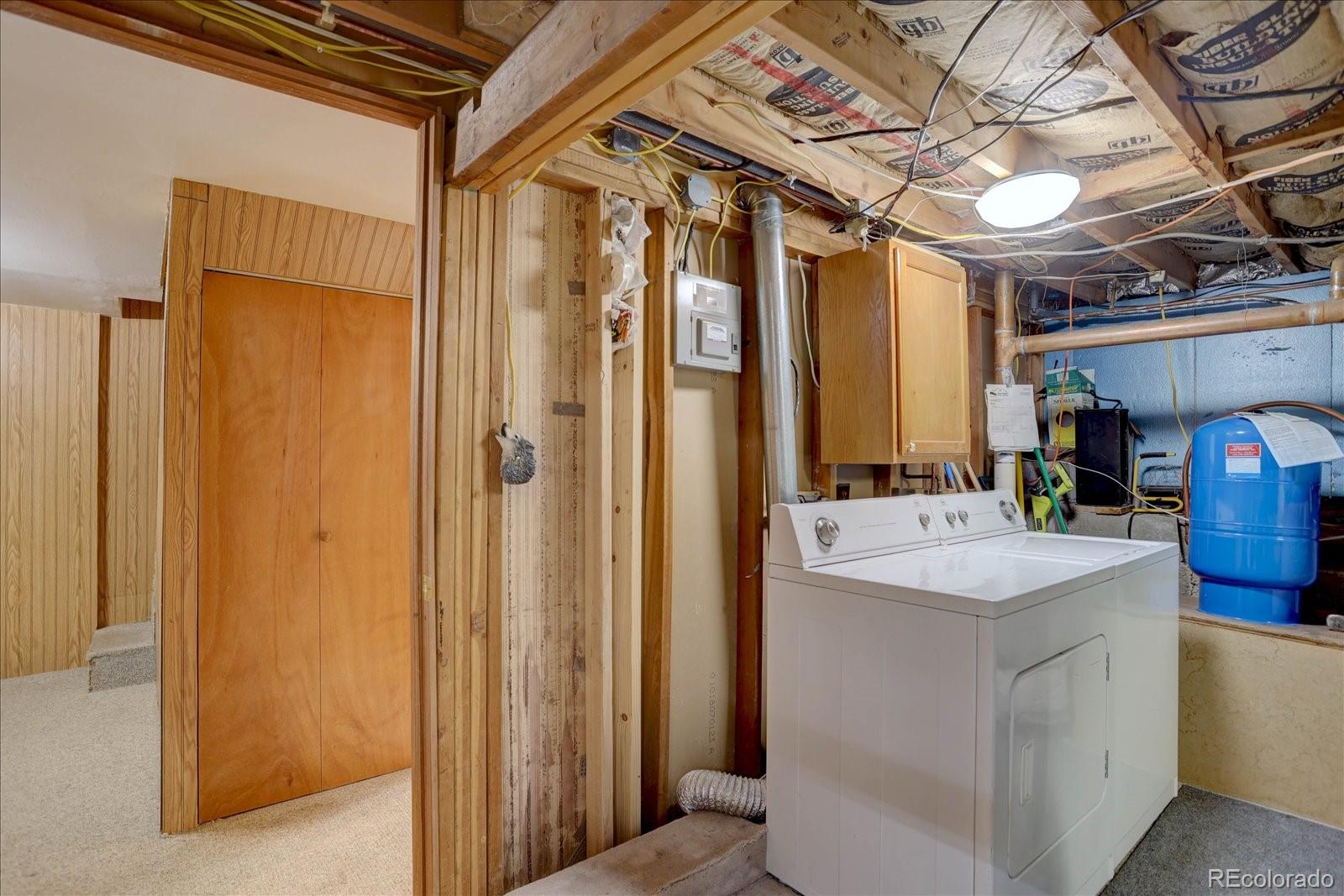 255 Saddlestring Road Bailey, CO 80421 - Photo 26 of 49 a bathroom with a sink a mirror and a shower
