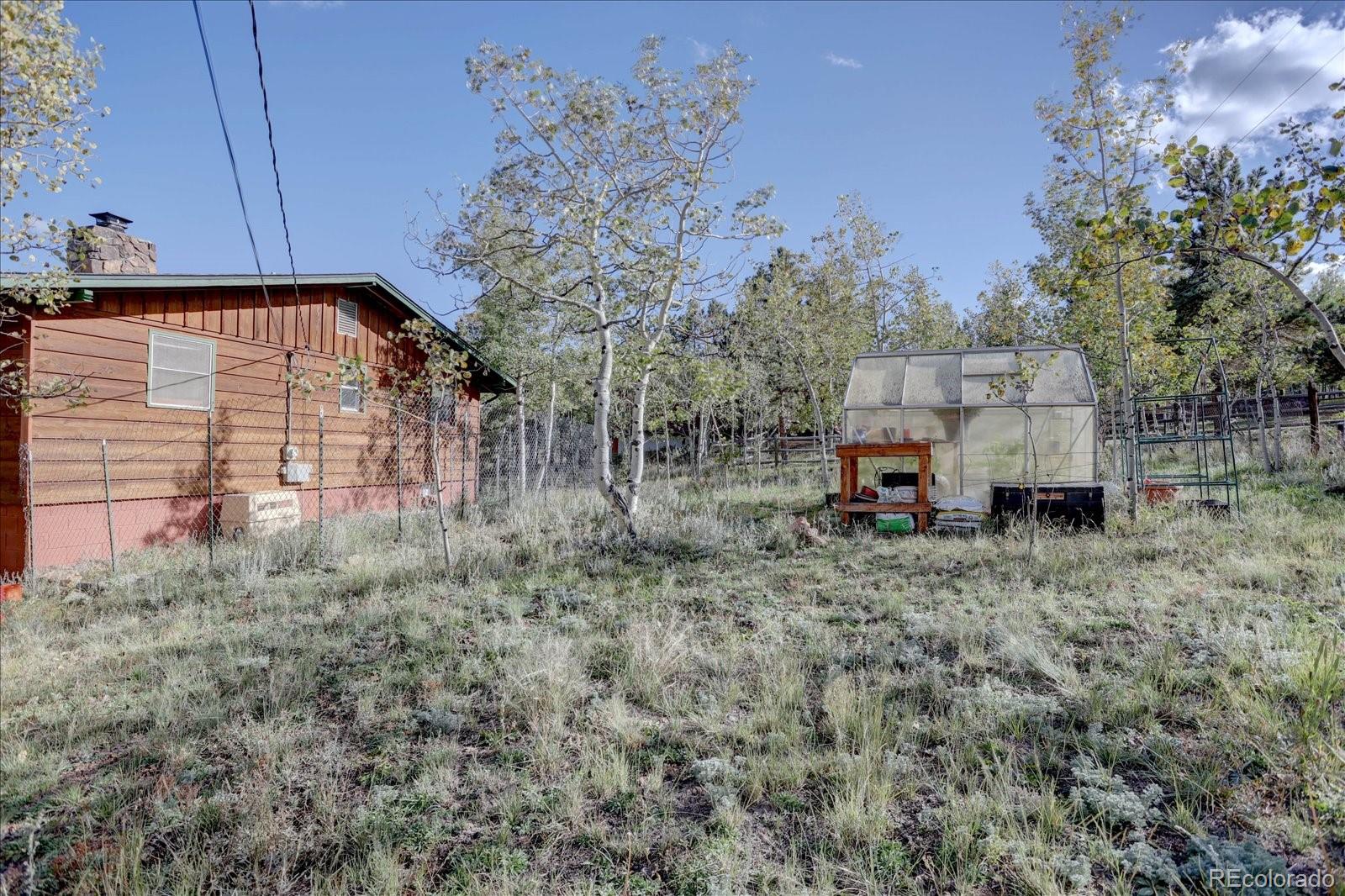 255 Saddlestring Road Bailey, CO 80421 - Photo 29 of 49 a view of a car park in front of the house