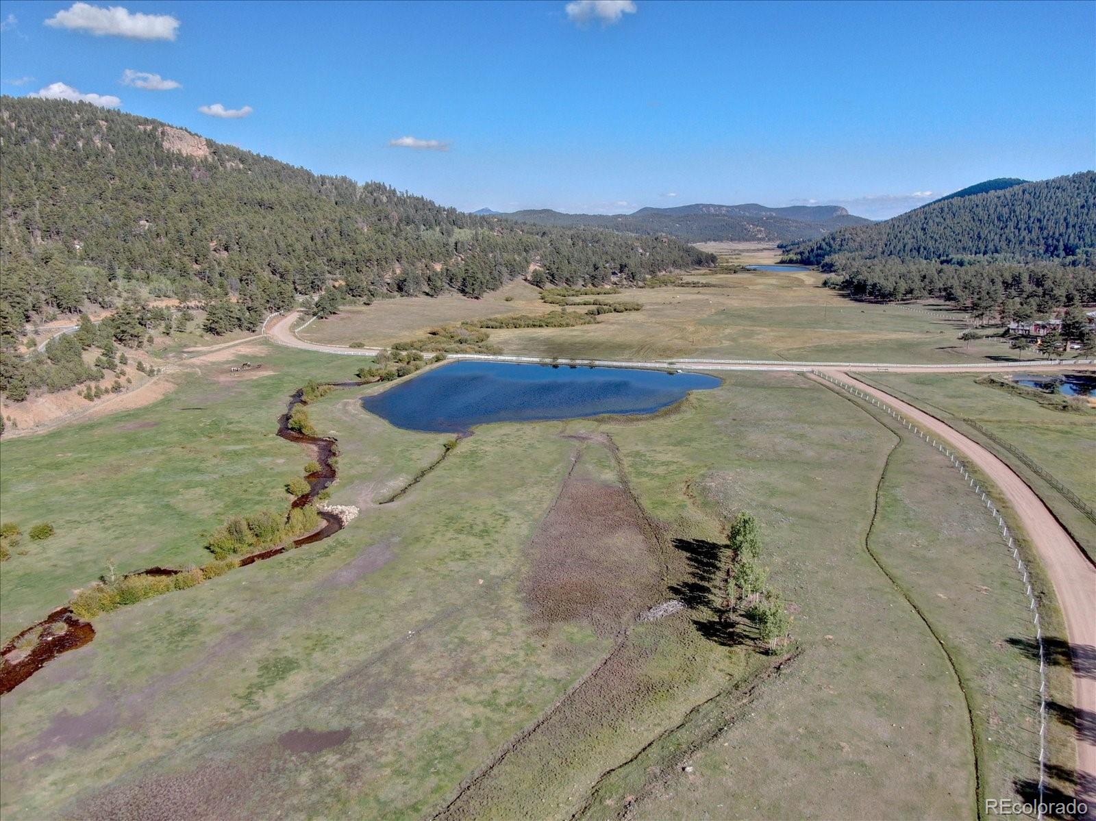 255 Saddlestring Road Bailey, CO 80421 - Photo 35 of 49 a view of a lake view and mountain view