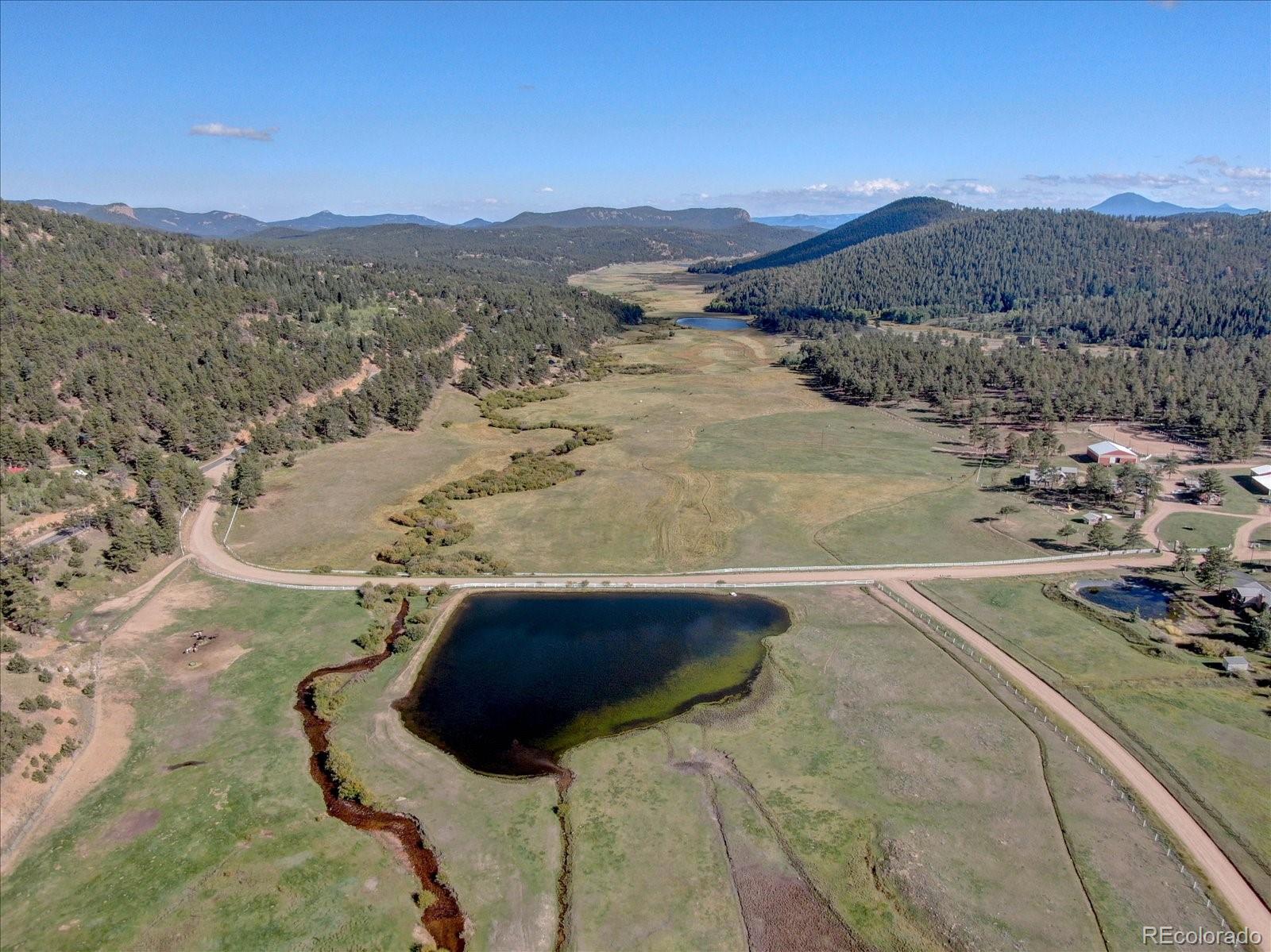 255 Saddlestring Road Bailey, CO 80421 - Photo 36 of 49 a view of a swimming pool with a mountain