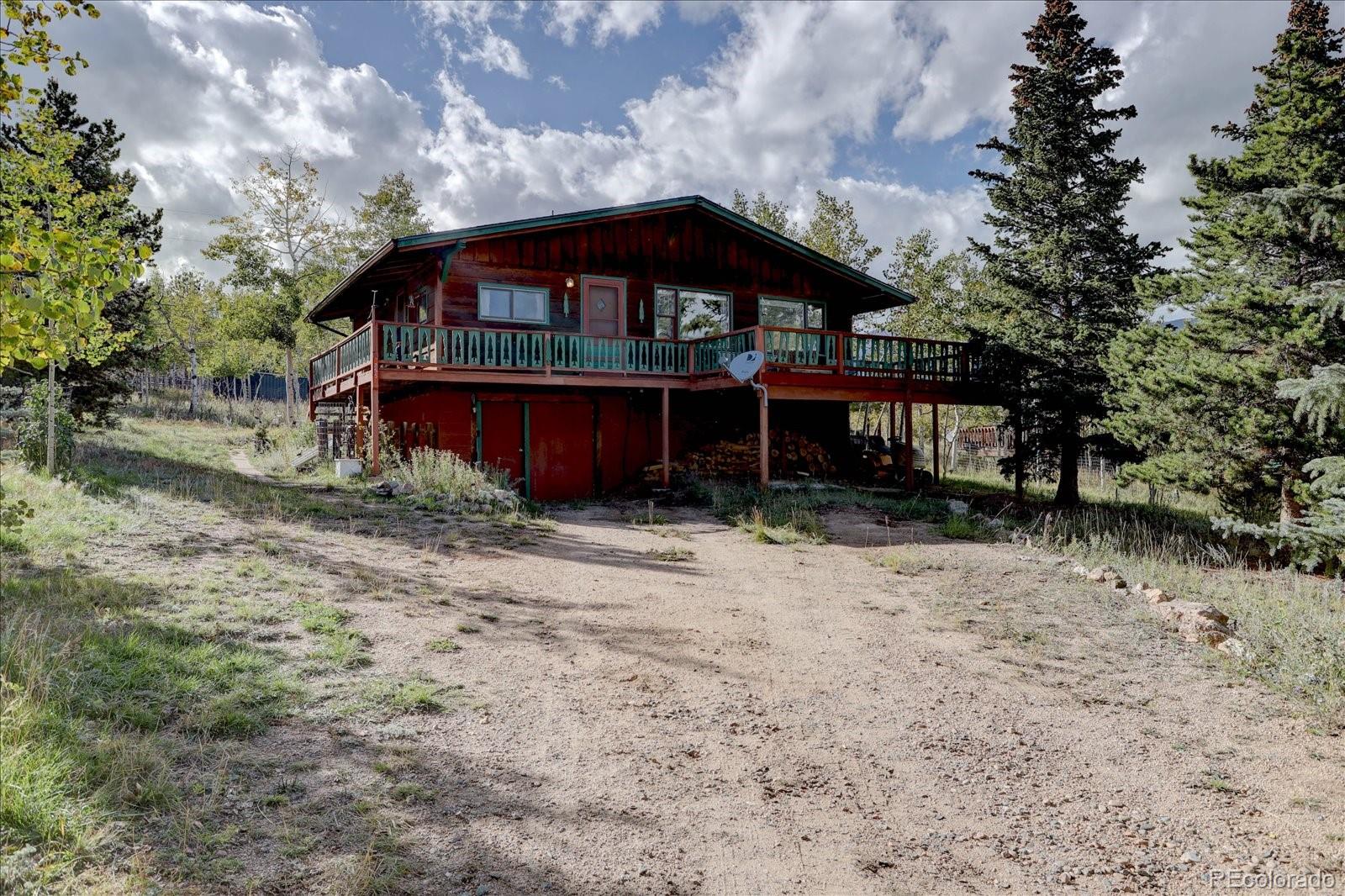 255 Saddlestring Road Bailey, CO 80421 - Photo 4 of 49 a view of a house with a yard