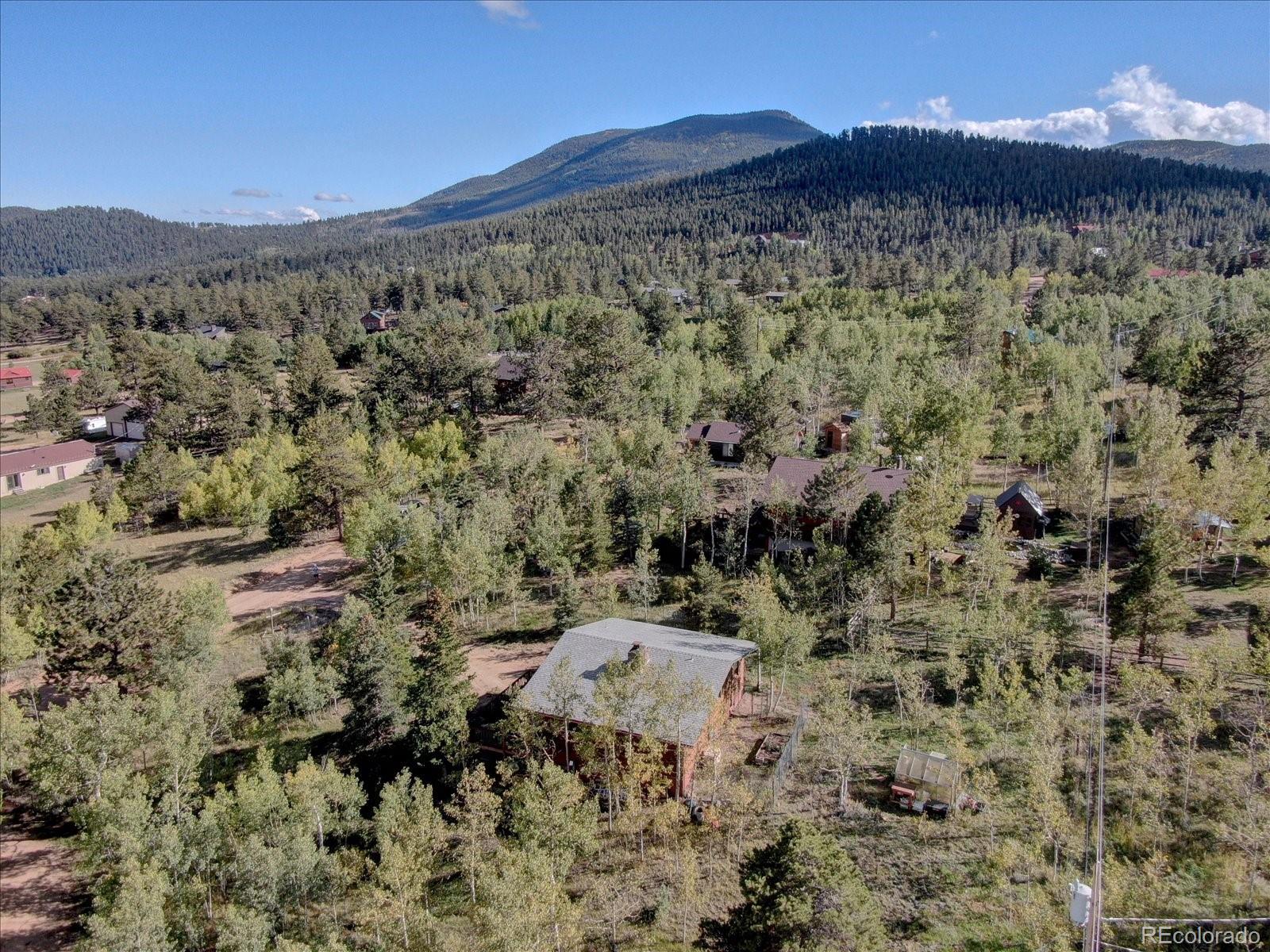 255 Saddlestring Road Bailey, CO 80421 - Photo 45 of 49 a view of a city with mountains in the background