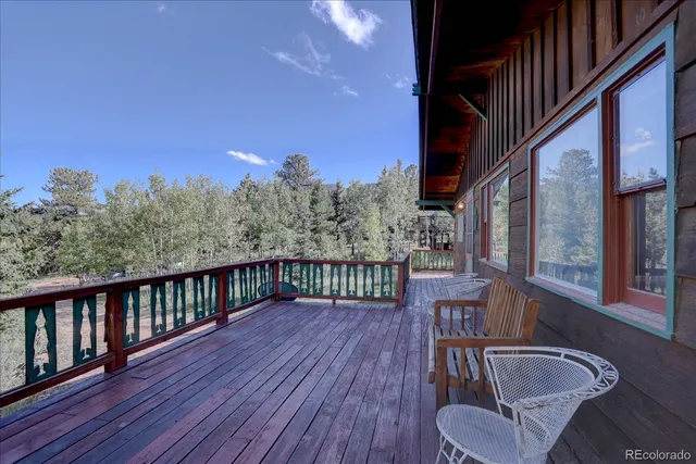 a view of balcony with furniture