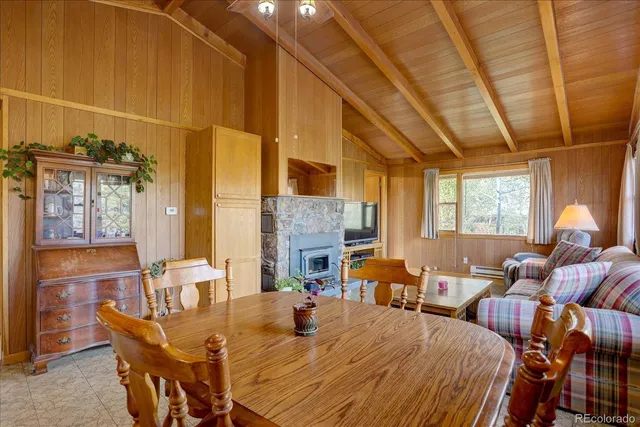 a dining room with furniture and window