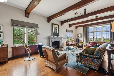 a living room filled with couches and a large window