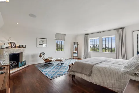 a living room with furniture and large windows