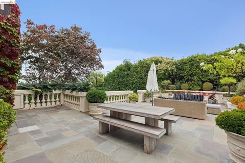 a outdoor space with lots of furniture and wooden floor