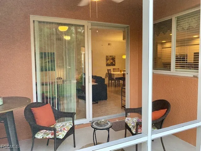 a kitchen with a sink dishwasher a stove and a dining table with wooden floor