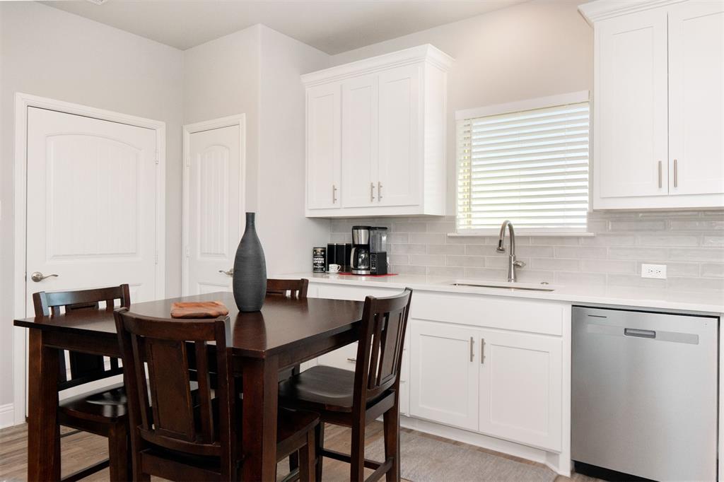 849 County Road 4764 Boyd, TX 76023 - Photo 35 of 40 a kitchen with stainless steel appliances granite countertop a table chairs sink and cabinets