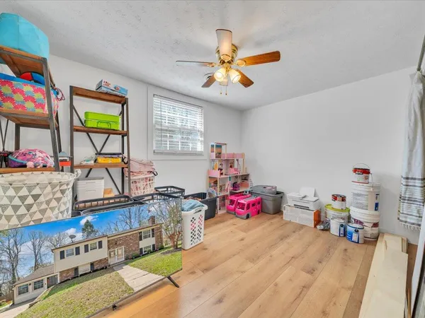 a view of play room with furniture and toys