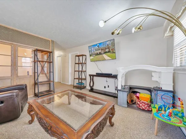 a living room with furniture and a fireplace