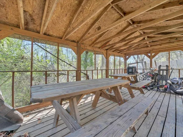 a view of a patio with wooden floor