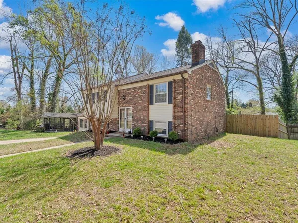 a view of a backyard of the house