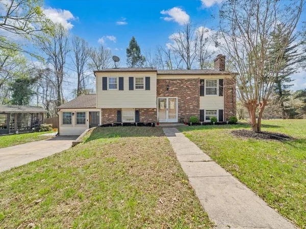a front view of a house with a yard
