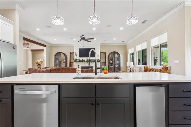 a spacious bedroom with a bed and a flat screen tv