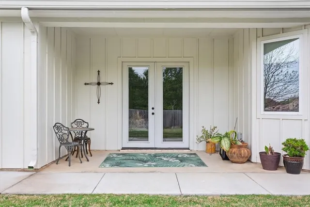 a living room with furniture a fireplace and a table