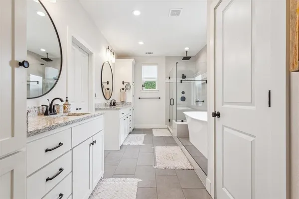 a view of a patio with table and chairs under an umbrella