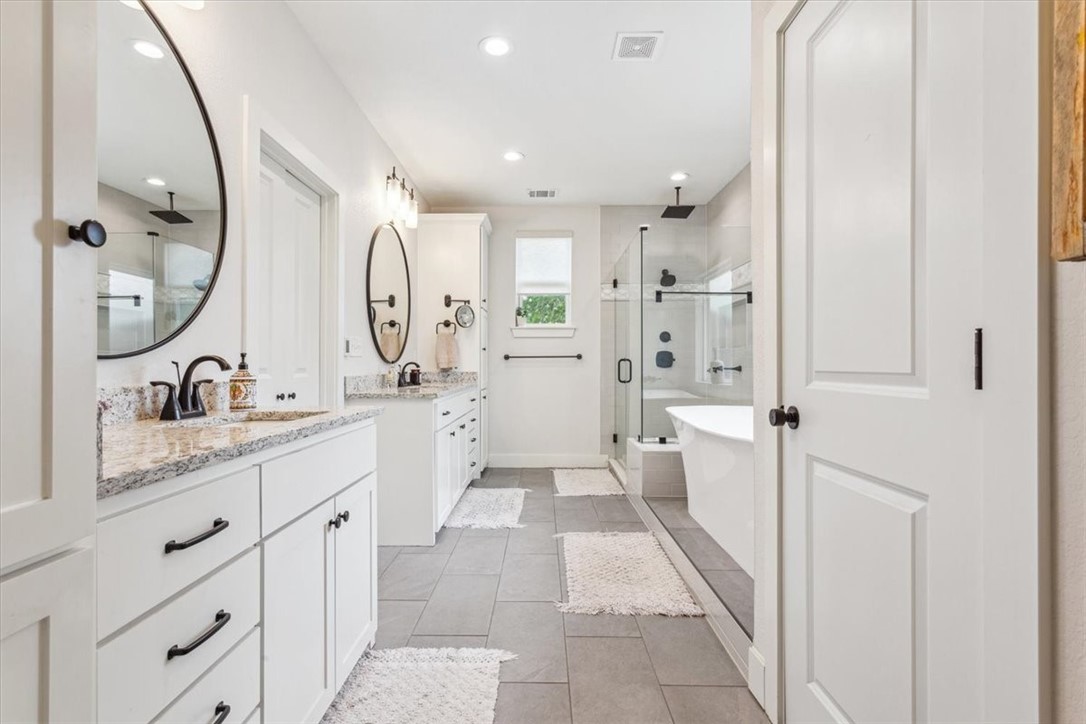 8 Independence Trail Waco, TX 76708 - Photo 22 of 39 a spacious bathroom with a double vanity sink mirror double and shower