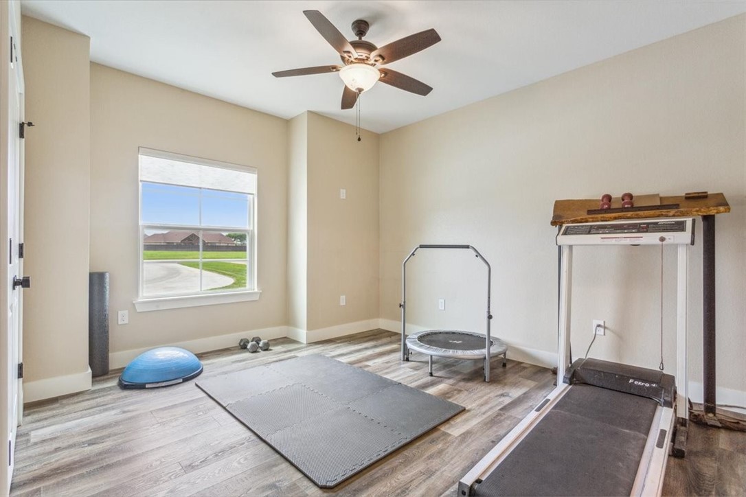 8 Independence Trail Waco, TX 76708 - Photo 30 of 39 a living room with a bed furniture and a window