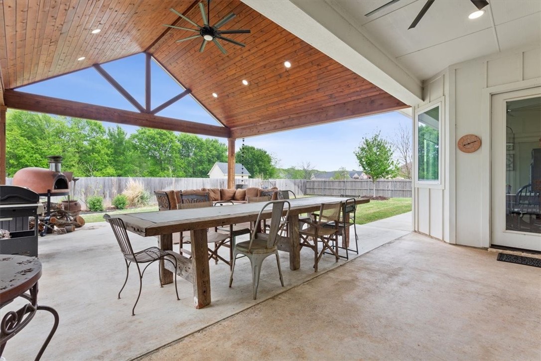 8 Independence Trail Waco, TX 76708 - Photo 32 of 39 a view of a patio with table and chairs under an umbrella