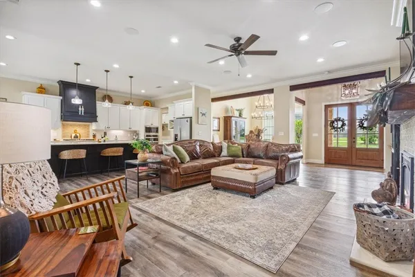 a living room with furniture fireplace and flat screen tv