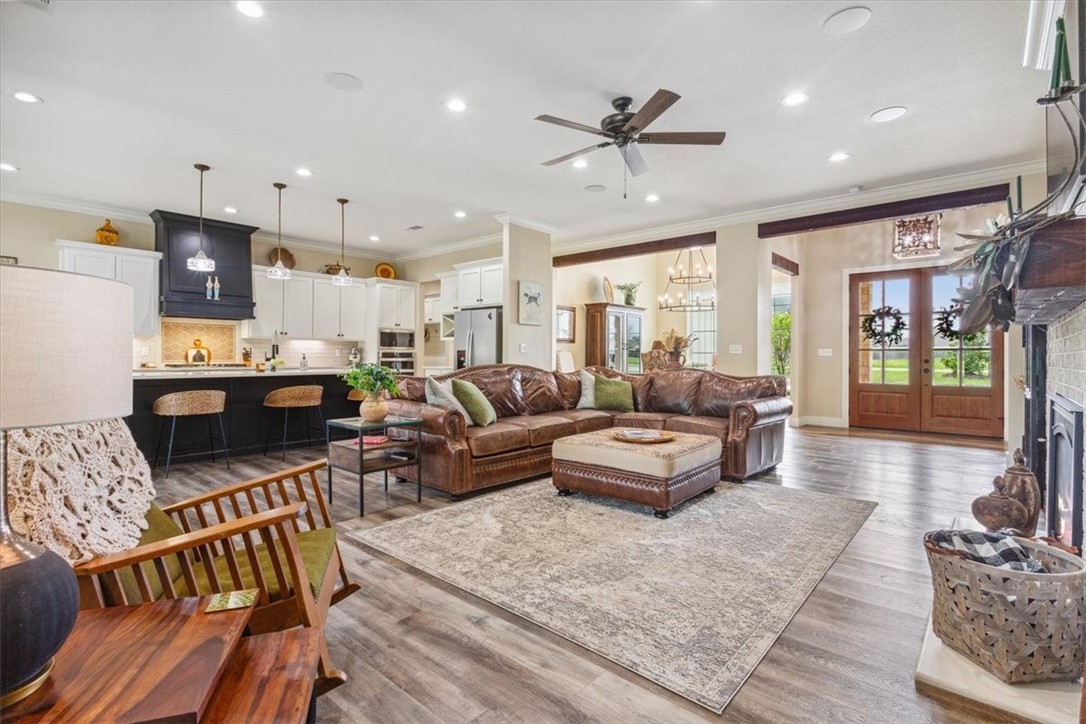 8 Independence Trail Waco, TX 76708 - Photo 7 of 39 a living room with furniture kitchen view and a chandelier